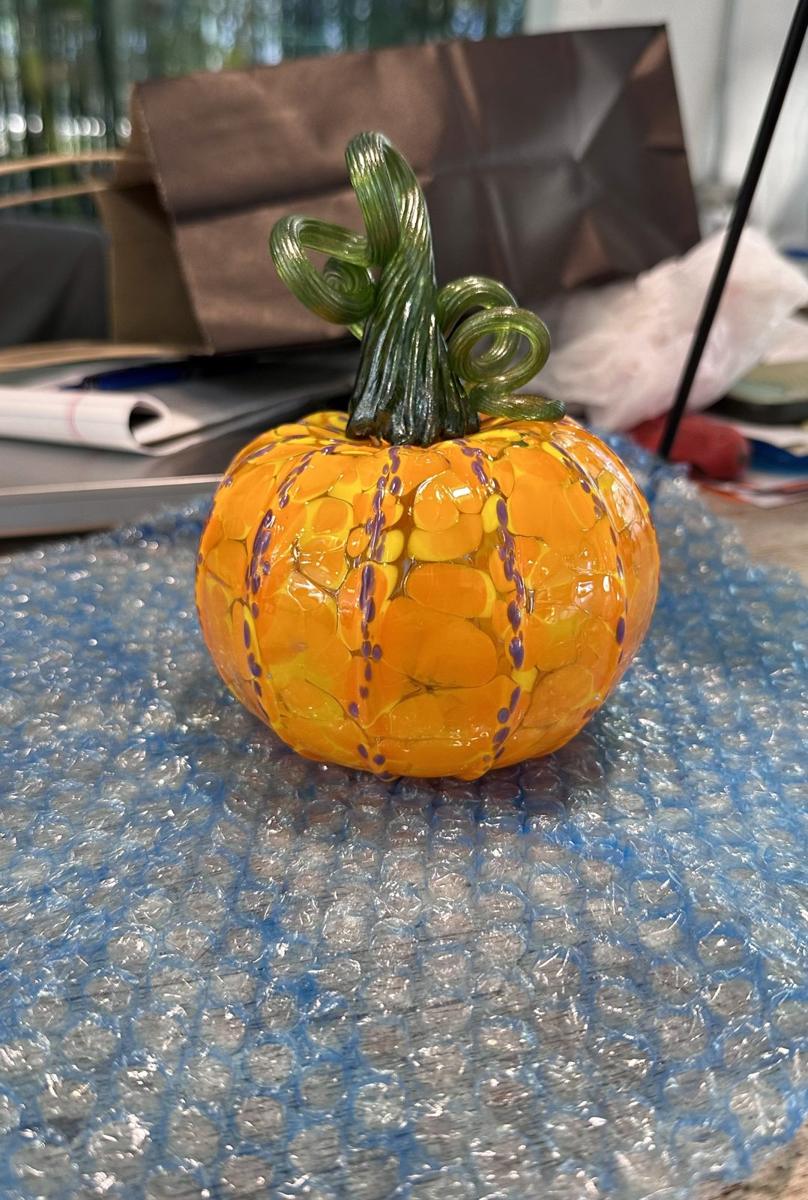 Brandy’s finished orange glass pumpkin with its green stem